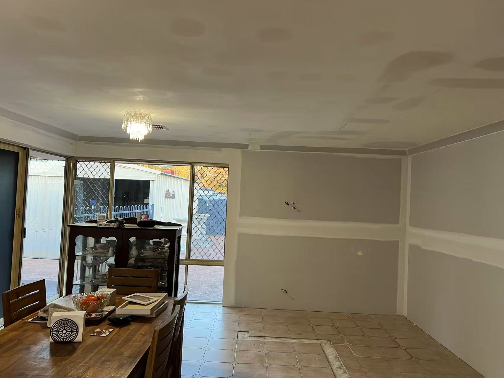 Recessed feature ceiling with bulkhead and cove lighting