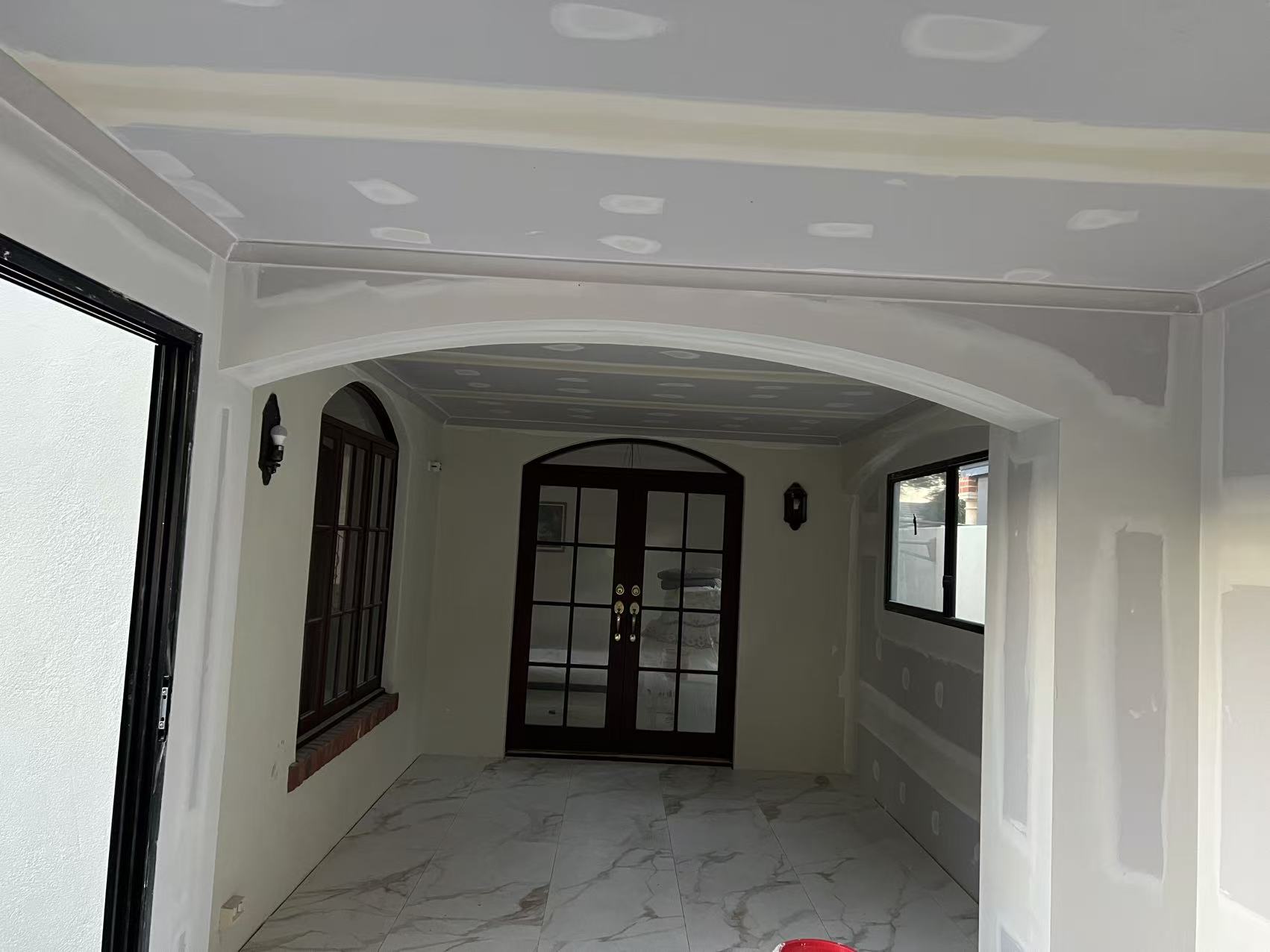 Patchy wall surface prepared for skim coat