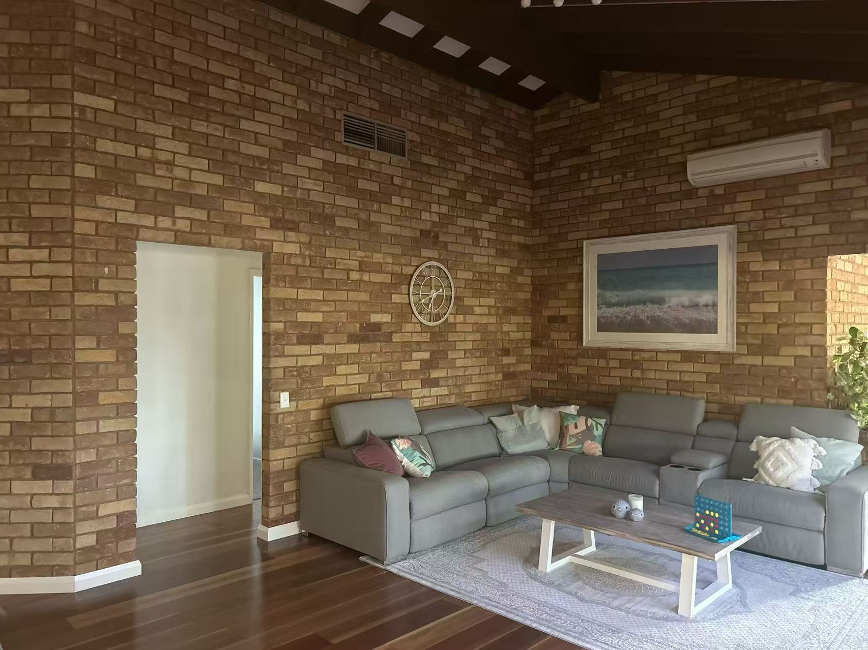 Completed living room with plasterboard ceiling and feature bulkhead